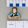 NerdyKeppie Dr. James Barry Historically Queer Enamel Pride Pin. Our NerdyKeppie Historically Queer Pride enamel pin features Dr. James Barry surrounded by flowers in your choice of rainbow, transgender, or gay men's/MLM pride colors. This pride pin ships from Portland, Oregon.