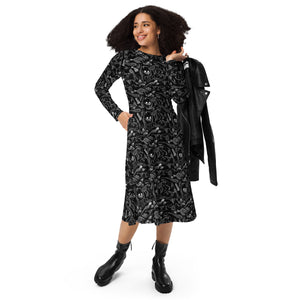A person wearing a NerdyKeppie Animal Skeletons Long Sleeve Midi Dress With Pockets. 