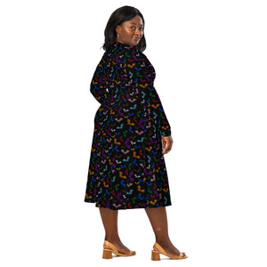 A person wearing a NerdyKeppie Engraved Bats Progress Pride Long Sleeve Midi Dress With Pockets. 