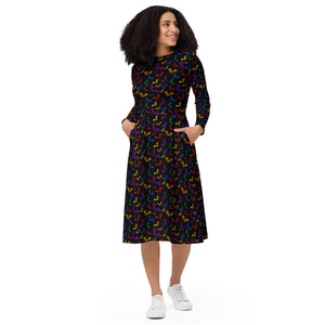 A person wearing a NerdyKeppie Engraved Bats Rainbow Gay Pride Long Sleeve Midi Dress With Pockets. 