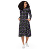 A person wearing a NerdyKeppie Raveyard Ghosts Genderqueer Pride Long Sleeve Midi Dress With Pockets. 