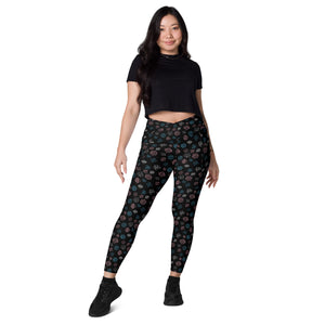 A person wearing a NerdyKeppie Scattered Dice Trans Pride Leggings With Pockets. 