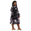 A person wearing a NerdyKeppie Splatter Wave Queer Pride Long Sleeve Midi Dress With Pockets. 