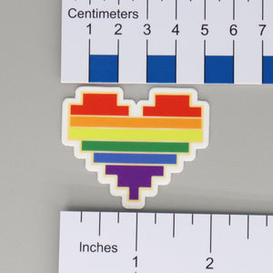 NerdyKeppie 8-Bit Heart Rainbow Gay Pride Sticker. Our NerdyKeppie 8-bit heart rainbow gay pride stickers feature a white border and the image of an 8-bit heart in a rainbow gradient of color. These 8-bit heart rainbow gay pride stickers ship from Portland, Oregon.