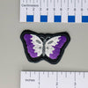 NerdyKeppie's Ace Psychedelic Butterfly Embroidered Pride Patch are shaped like their namesake and stitched on black duck cloth!