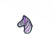 NerdyKeppie's Ace Zebra Embroidered Pride Patch are shaped like their namesake and stitched on black duck cloth!