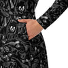 A person wearing a NerdyKeppie Animal Skeletons Long Sleeve Midi Dress With Pockets. 