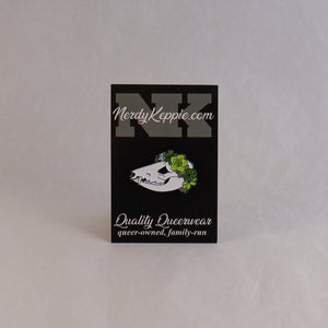 NerdyKeppie Proud to the Bone Possum Skull Pride Enamel Pins. A possum skull pride enamel pin for our Proud to the Bone project, wearing an adorable crown of flowers!