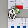 NerdyKeppie Proud to the Bone Sabertooth Tiger Skull Pride Enamel Pins. A Sabertooth Tiger skull pride enamel pin for our Proud to the Bone project, a perfect prehistoric gift for your favorite nerd. This prehistoric pin wears an adorable flower crown!