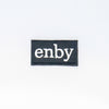 NerdyKeppie's BONEYARD "Enby" Embroidered Non-Binary Pride Patch are stitched on sturdy rectangular duck cloth and backed with vinyl fuse.