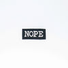 NerdyKeppie's BONEYARD "NOPE" Embroidered Patch are stitched on sturdy rectangular duck cloth and backed with vinyl fuse.