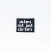 NerdyKeppie's BONEYARD "Sisters Not Just Cis-Ters" Embroidered Trans Pride Patch are stitched on black duck cloth and backed by sturdy vinyl fuse.