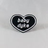 NerdyKeppie's "Baby Dyke" Heart Embroidered Pride Patch are stitched on black duck cloth and backed by sturdy vinyl fuse.