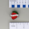 NerdyKeppie Berry Your Gays Enamel Pins. Our Berry Your Gays Enamel Pins feature a strawberry and a white scroll with black text reading "BERRY YOUR GAYS". These enamel pins ship from Portland, Oregon USA.