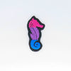 NerdyKeppie's Bi BONEYARD Seahorse Embroidered Pride Patch are shaped like their namesake and stitched on black duck cloth!