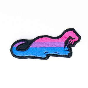 NerdyKeppie's Bi Otter Embroidered Pride Patch are shaped like their namesake and stitched on black duck cloth!