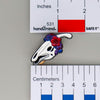 NerdyKeppie Proud to the Bone Parasauralophus Skull Pride Enamel Pins. A Parasauralophus skull pride enamel pin for our Proud to the Bone project. This prehistoric pin is wearing an adorable crown of flowers!