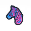 NerdyKeppie's Bi Zebra Embroidered Pride Patch are shaped like their namesake and stitched on black duck cloth!