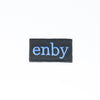 NerdyKeppie's Blue "Enby" Embroidered Non-Binary Pride Patch are stitched on sturdy rectangular duck cloth and backed with vinyl fuse.