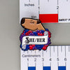 NerdyKeppie Capybara Enamel Bi Pride Pronoun Pins. Our enamel pin features an adorable capybara, a paper scroll with six different pronoun choices, and flowers in bisexual pride colors. This pride pin ships from Portland, Oregon.