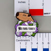 NerdyKeppie Capybara Enamel Genderqueer Pride Pronoun Pins. Our enamel pin features an adorable capybara, a paper scroll with three different pronoun choices, and flowers in genderqueer pride colors. This pride pin ships from Portland, Oregon.
