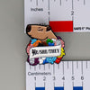 NerdyKeppie Capybara Enamel Progress Pride Pronoun Pins. Our enamel pin features an adorable capybara, a paper scroll with six different pronoun choices, and flowers in Progress pride colors. This pride pin ships from Portland, Oregon.