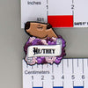 NerdyKeppie Capybara Enamel Queer Pride Pronoun Pins. Our enamel pin features an adorable capybara, a paper scroll with seven different pronoun choices, and flowers in queer pride colors. This pride pin ships from Portland, Oregon.