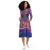 A person wearing a NerdyKeppie Carina Nebula Bi Pride Long Sleeve Midi Dress With Pockets. 