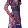 A person wearing a NerdyKeppie Carina Nebula Genderfluid Pride Long Sleeve Midi Dress With Pockets. 