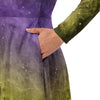 A person wearing a NerdyKeppie Carina Nebula Non-Binary Pride Long Sleeve Midi Dress With Pockets. 