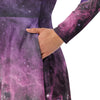 A person wearing a NerdyKeppie Carina Nebula Queer Pride Long Sleeve Midi Dress With Pockets. 