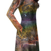 A person wearing a NerdyKeppie Carina Nebula Rainbow Gay Pride Long Sleeve Midi Dress With Pockets. 