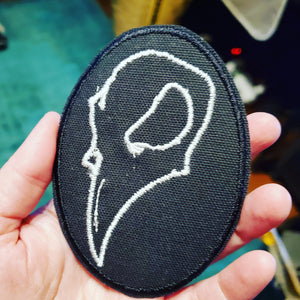 NerdyKeppie's Crow Skull Embroidered Halloween Patch are shaped like their namesake and stitched on black duck cloth!