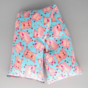 A NerdyKeppie Cute Little Piggies Being Clean and Having Personalities Flannel Heat & Cold Packs. A microwaveable heat and cold pack featuring a pig-themed design, great gift for animal loving friends with, you know, achy joints and stuff.