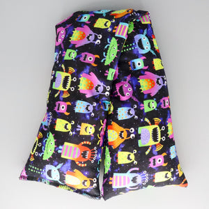 A NerdyKeppie Cute Space Aliens Flannel Heat & Cold Packs. A microwaveable heat and cold pack featuring an adorable-themed design, great gift for alien-loving friends with, you know, achy joints and stuff.