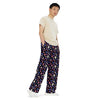 A person wearing a NerdyKeppie Dog Paws Genderfluid Pride Unisex Wide-Leg Pants With Pockets. 