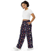 A person wearing a NerdyKeppie Dog Paws Genderfluid Pride Unisex Wide-Leg Pants With Pockets. 
