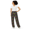 A person wearing a NerdyKeppie Dog Paws Lesbian Pride Unisex Wide-Leg Pants With Pockets. 