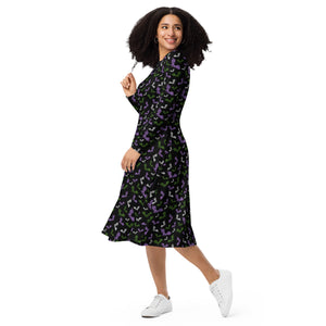 A person wearing a NerdyKeppie Engraved Bats Genderqueer Pride Long Sleeve Midi Dress With Pockets. 