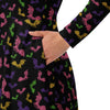 A person wearing a NerdyKeppie Engraved Bats Lesbian Pride Long Sleeve Midi Dress With Pockets. 