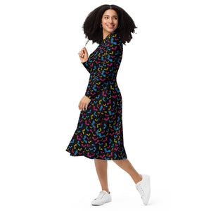 A person wearing a NerdyKeppie Engraved Bats Pan Pride Long Sleeve Midi Dress With Pockets. 
