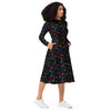 A person wearing a NerdyKeppie Engraved Bats Progress Pride Long Sleeve Midi Dress With Pockets. 