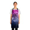 A person wearing a NerdyKeppie Galaxy Bi Pride Apron With Pocket. A black apron with a galaxy design on it in bisexual pride colors. This bi pride pocket apron is made of durable 100% polyester.