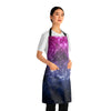 A person wearing a NerdyKeppie Galaxy Bi Pride Apron With Pocket. A black apron with a galaxy design on it in bisexual pride colors. This bi pride pocket apron is made of durable 100% polyester.