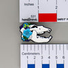 NerdyKeppie Proud to the Bone Cave Bear Skull Pride Enamel Pins. A Cave Bear skull pride enamel pin for our Proud to the Bone project. This prehistoric pin is wearing an adorable crown of flowers!