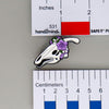 NerdyKeppie Proud to the Bone Parasauralophus Skull Pride Enamel Pins. A Parasauralophus skull pride enamel pin for our Proud to the Bone project. This prehistoric pin is wearing an adorable crown of flowers!