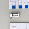 NerdyKeppie Paper Scroll Pronoun Enamel Pins. Enamel pins featuring your choice of pronouns in a black old English font on a white stylized paper scroll. Each pin measures 1.25" across and ships from Portland, Oregon USA.