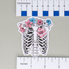 NerdyKeppie Human Ribcage Trans Pride Stickers. Our NerdyKeppie Human Ribcage Transgender Pride Stickers feature a human ribcage decorated with flowers in the transgender pride flag colors. These human ribcage transgender pride stickers measure 2.5" x 3" and ship from Portland, Oregon.