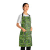 A person wearing a NerdyKeppie Lemurs Progress Pride Apron With Pocket. A sturdy poly twill apron with a pattern of lemurs and foliage on it. This pride pocket apron has an adjustable neck and two pockets.
