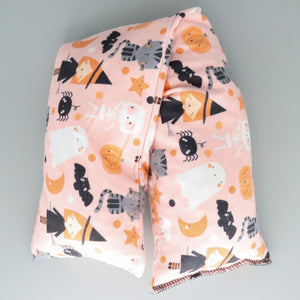 A NerdyKeppie Little Witches Cotton Flannel Heat & Cold Pack. A microwaveable heat and cold pack featuring a witch-themed design, great gift for friends with, you know, achy joints and stuff.